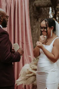 Two individuals exchanging vows as their celebration of love