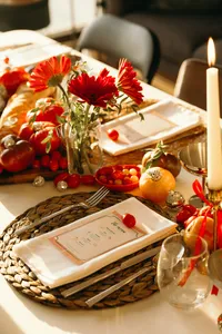 Table setting with menu, fruits, vegetables and beautiful greenery