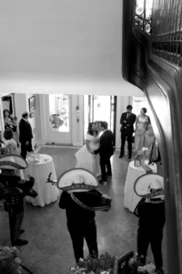 Black and white image of two humans dancing at wedding reception