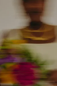 Motion image with blur with colorful florals and human in the background