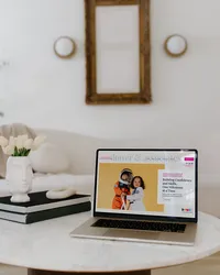 Dower & Associates Showit website displayed on a laptop in a bright neutral interior.