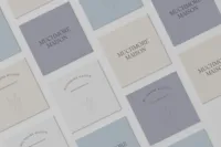 Muchmore Maison printed brand collateral featuring the logo and floral identity details.