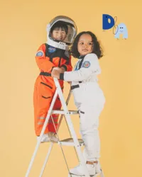 Dower & Associates illustrated brandmark paired with brand imagery of two children dressed as astronauts.