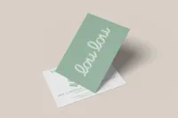 Mint green Lou Lou card displayed over coordinating printed collateral.