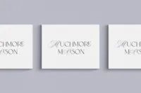 Muchmore Maison business cards with the lyrical script wordmark