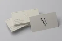 Muchmore Maison business cards and stationery featuring the brand monogram.