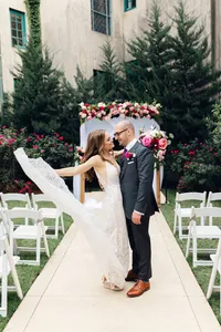 Bride-groom-embracing-during-dress-toss-dresser-manion-wedding-venue-tulsa-1