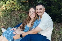 woman-leaning-against-man-during-engagement-session-okc