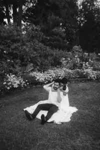 A soon to be bride locking arms around her finance's neck.
