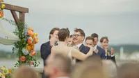 A groom embracing the bride.