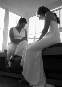 A couple writing their vows in front of each other.