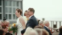 A just married couple running down the isle.