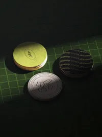 stack-of-coaster-mockups-on-a-tile-isometric