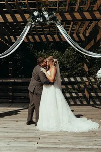 Bride and groom during barn wedding ceremony at Mason Farms in North Georgia, shot by Crimson Conure Photography based in Denver, Colorado and Kennesaw, Georgia