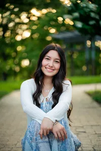 Minneapolis senior photographer capturing a smiling high school senior portrait in a beautiful Minnesota park.