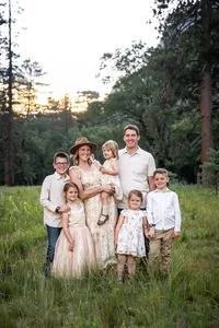 Minneapolis family photographer capturing a family portrait in a scenic Minnesota park.