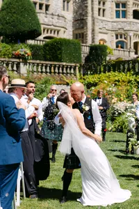 Bride and groom walking through their guests after the ceremony at Hatley Castle