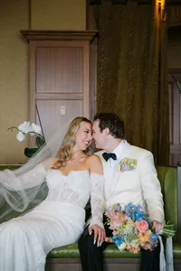 Newlyweds laughing together during portraits on Vancouver Island