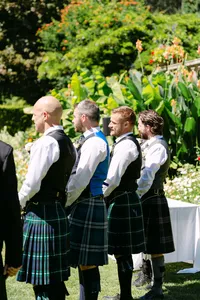 Groomsmen in kilts standing together at a Hatley Castle wedding