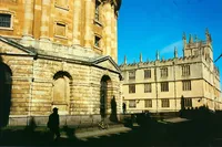 Radcliffe Camera and the Bodleian in Oxford under a blue sky, 35mm film wedding photograph
