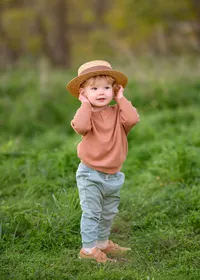 playful-toddler-portrait-with-hat-melbourne-family-photographer