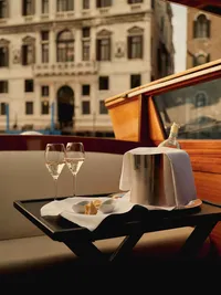 Elegant dining table inside a luxury train carriage with panoramic windows