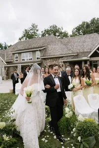 Charlotte wedding planner Bride and father of the bride walking down the ceremony aisle in front of guests