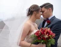 Bride and groom sharing an intimate wedding portrait in Myrtle Beach, South Carolina, photographed by Amberlee Christey.