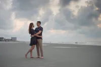 Couple on the beach during a Myrtle Beach SC proposal and engagement session photographed by Amberlee Christey.