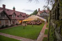 Elegant outdoor wedding reception under a clear tent at Linden Hall in West Virginia, photographed by Amberlee Christey.