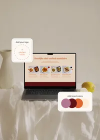 Laptop displaying a meal website in a warm orange and red color scheme, with examples for adding a logo and brand colors.
