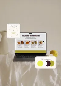 Laptop displaying a meal website in a green color scheme, with examples for adding a logo and brand colors.