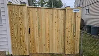 A close-up view of a freshly installed custom wood privacy fence panel securing a Maryland property.