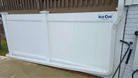 Newly installed white vinyl privacy fence section showcasing heavy-duty rails and precision alignment in the Baltimore area by Blue Crab Fence & Home.
