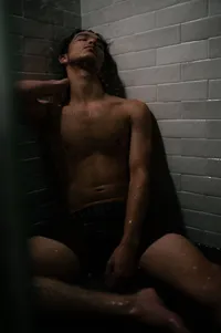 A Quiet Portrait in the Tiled Shower.
