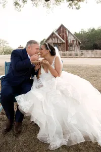 Bride and groom sharing a quesadilla "lady and the tramp" style on their wedding day.