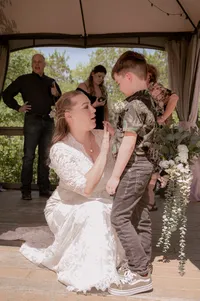 Bride stops the ceremony to comfort her autistic step-son during their wedding.