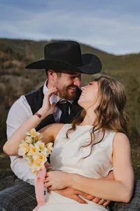Newlyweds Share a Laugh in the Mountains.