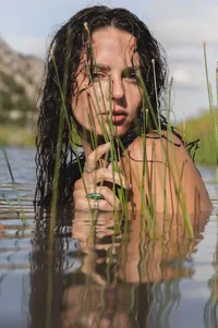 A River Portrait Among the Reeds.