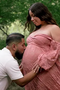 A Kiss on the Baby Bump by the Creek.