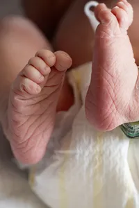 Close-up of a newborn baby's feet.