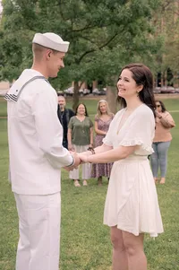 Holding Hands During an Outdoor Wedding Ceremony.