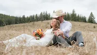 Newlyweds Relax in a Mountain Meadow.