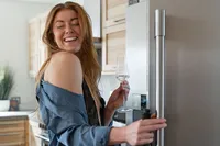 Laughing in the Kitchen with a Wine Glass.