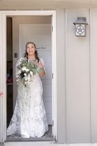 Bride getting ready to exit the backdoor for her backyard wedding ceremony.