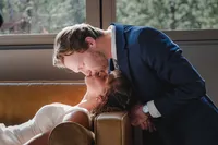A Wedding Day Kiss Beside the Window.