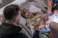 Holding Hands During the First Skin-to-Skin Cuddle.