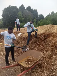 Copy of Kamazen and Octavio shovel woodchips