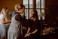 Bridesmaid getting soft glam bridal makeup by The Bridal Glam Group