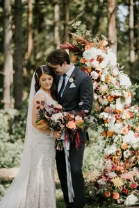 Bride wearing soft glam makeup with glowing skin and glam waves with hair extensions